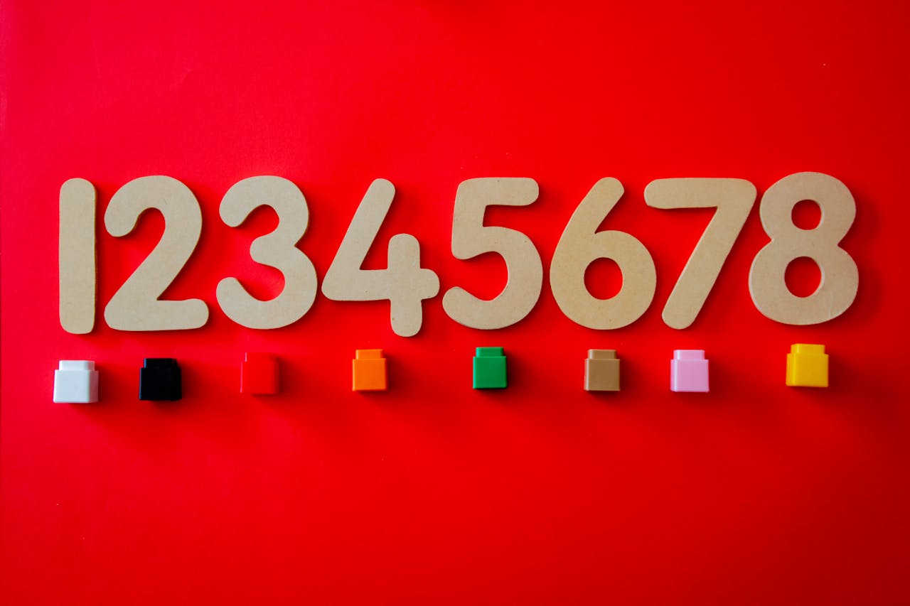 Bold numbers and colorful blocks on a vibrant red surface, perfect for educational use.